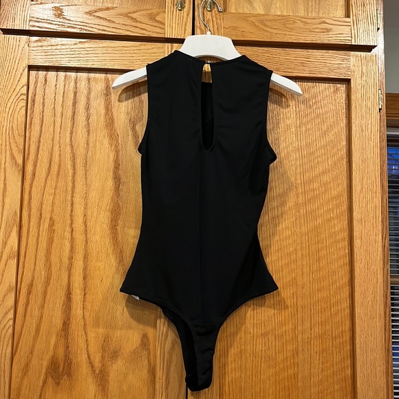 Black cutout body suit, high neck with cutouts on chest and abdomen. - Picture 4 of 4